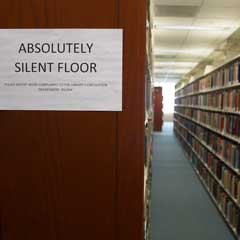 Quiet sign and book stacks on Floor 5