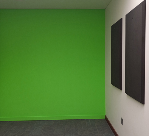 Audio/Video Recording Room containing backdrop stand, sound baffling, and a computer workstation