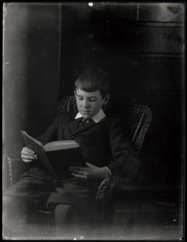 Richard in Long Overcoat, also in Chair Reading, December 1911