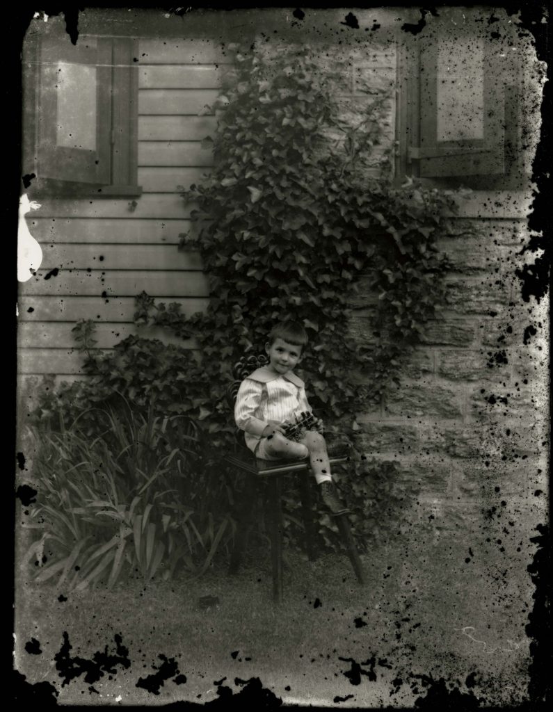 Boy Holding Toy Train