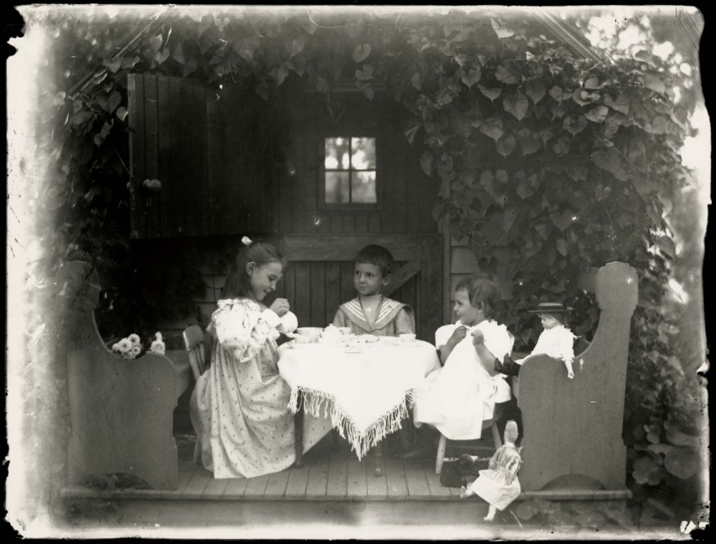 Three Children at Table with Tea Set