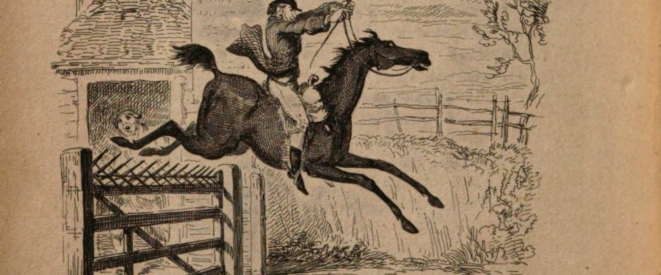 A man leaps a black horse over a fence in the countryside