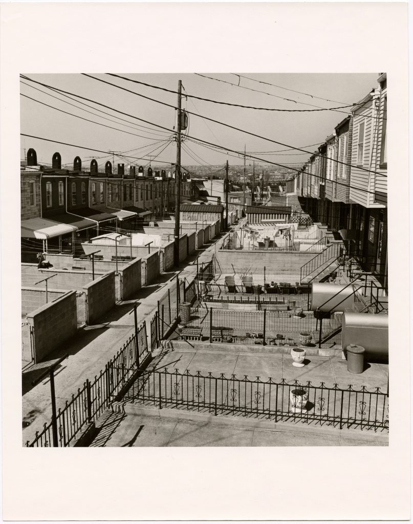 Aerial view of street alley with rowhomes backyards