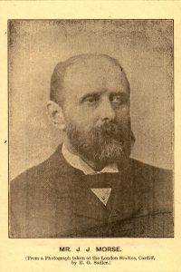 Mr. J. J. Morse, from a photograph taken at the London Studios, Cardiff, by E. G. Sadler. The portrait shows a man with balding hair and a graying beard and mustache, wearing a dark suit.