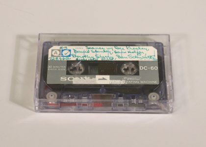 Cassette tape with handwritten label at the top.