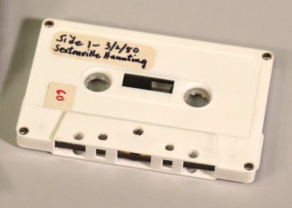 Cassette tape with a handwritten label on the upper left.