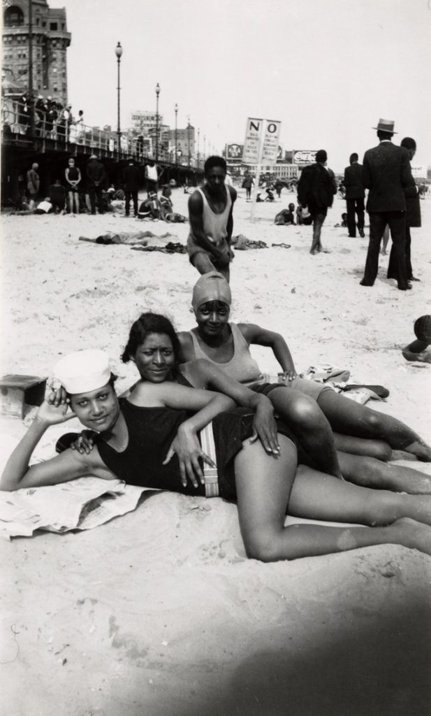 Three women posing on a beach