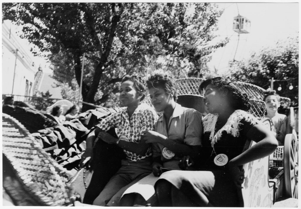 Little rock nine kids visiting coney island pictured on amusement park ride