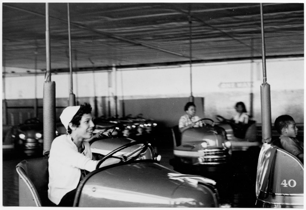 Little rock nine kids visiting coney island pictured on bumper cars