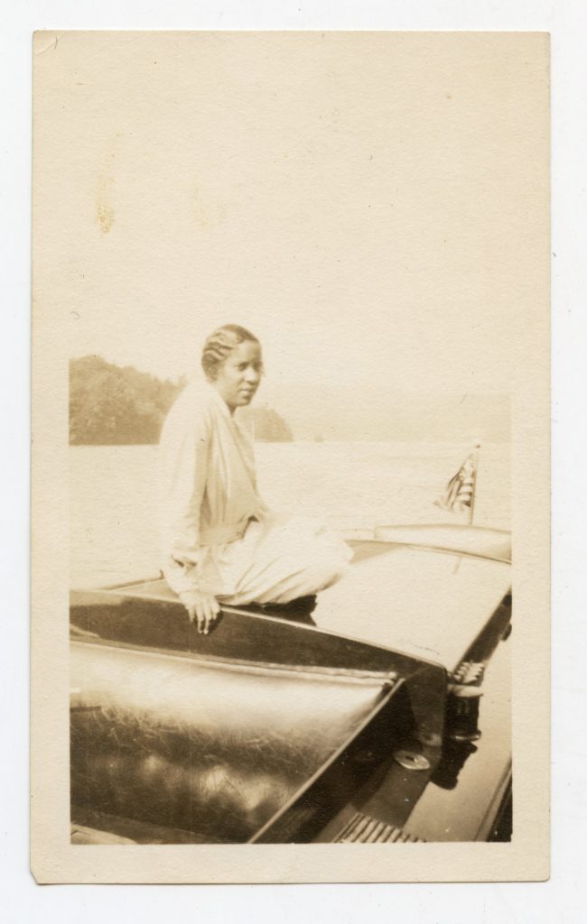 Woman sitting on boat.