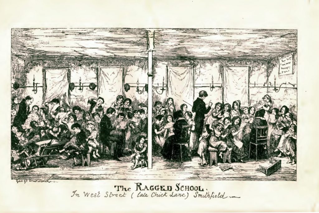 Two men in long black coats teach a room full of poor looking children who are crowded into a classroom.