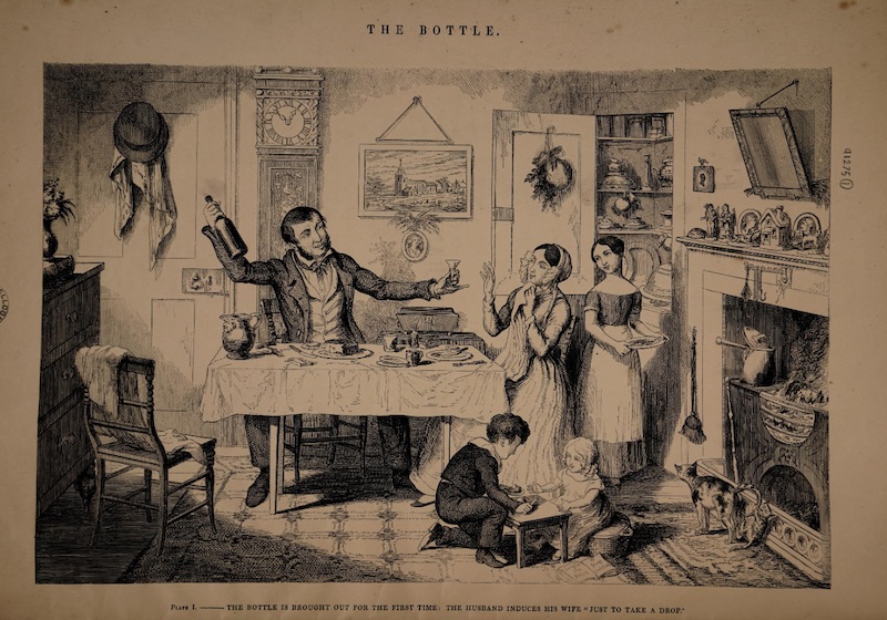 A father offers his wife a glass of wine as their kids eat at a small table of their own