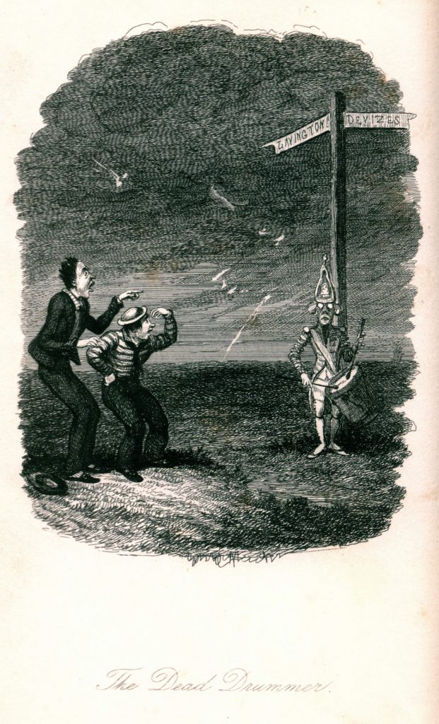 Two men stand outside on a dark and windy night by a road sign. Under the sign stands a ghostly drummer with white eyes.