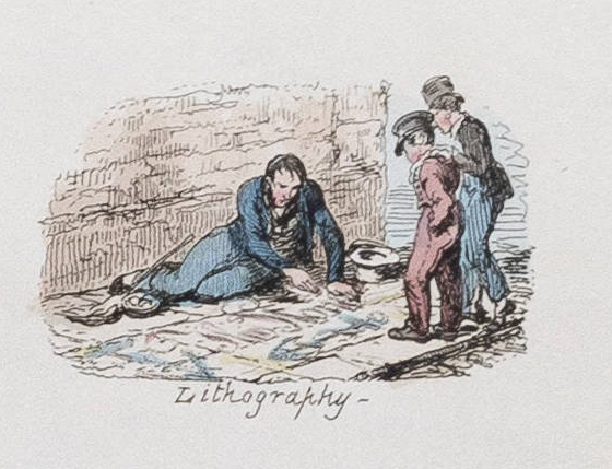 A man sits on the sidewalk sketching while two people look on. 