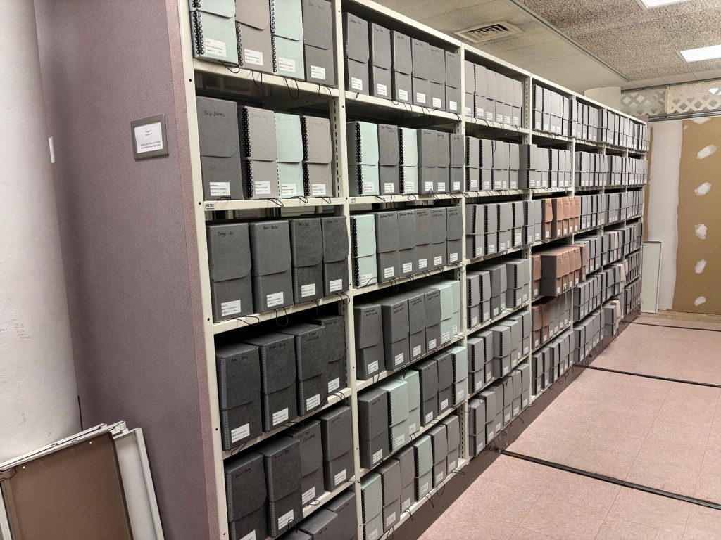Storage shelving with gray boxes