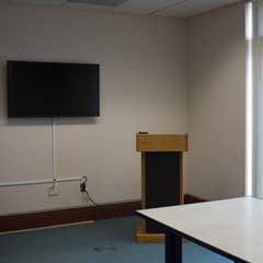 Podium and screen in the Presentation Practice Room