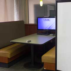Booth, computer, and whiteboard in the Retriever Learning Center RLC